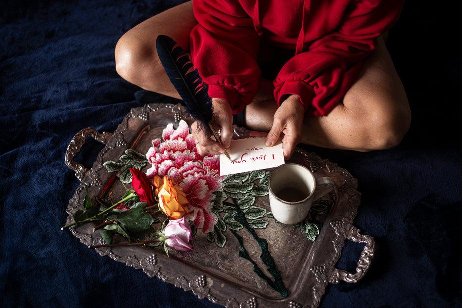 Feather-Written Love Note on Valentine Promise Day