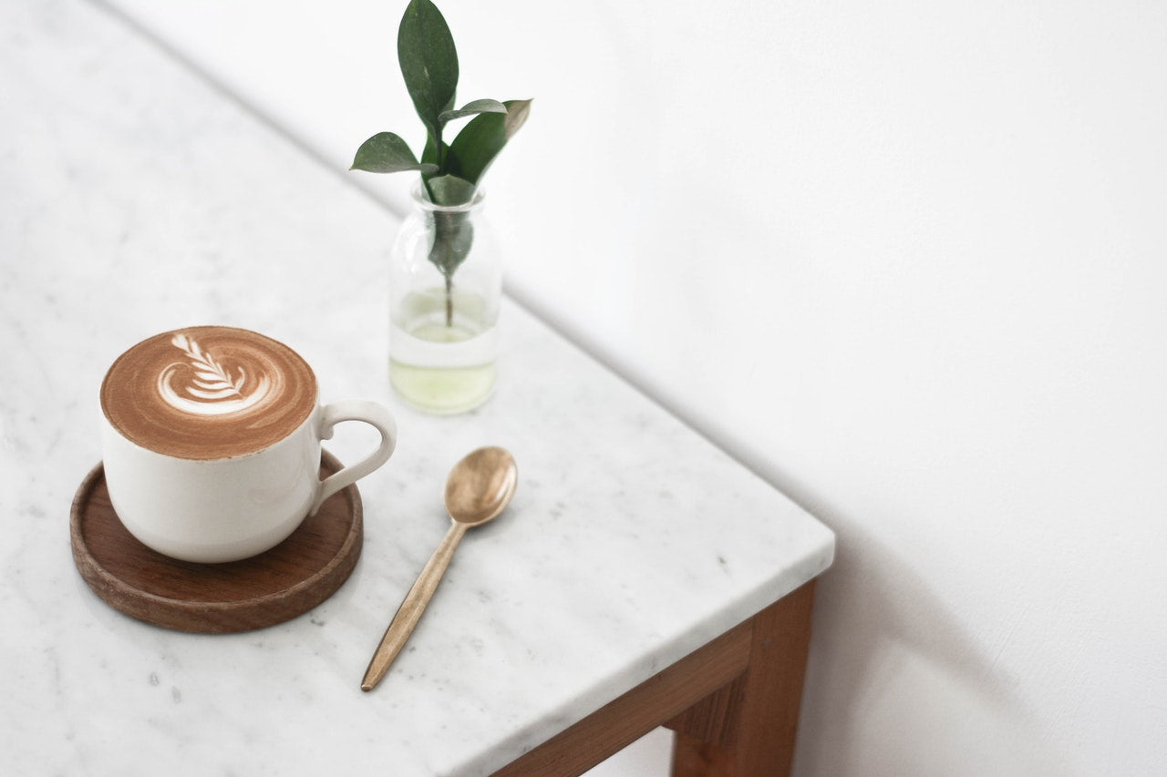 Coffee mug with spoon & table plant