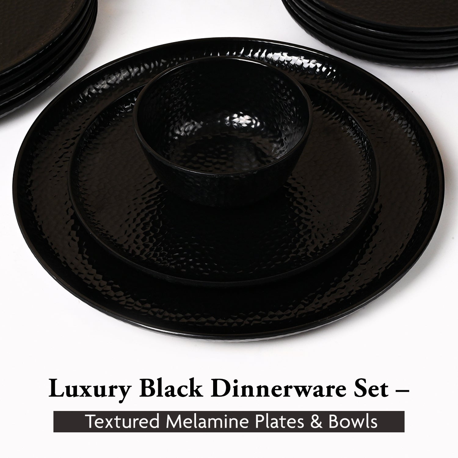 Black dinnerware set with textured melamine plates and bowls on a white background